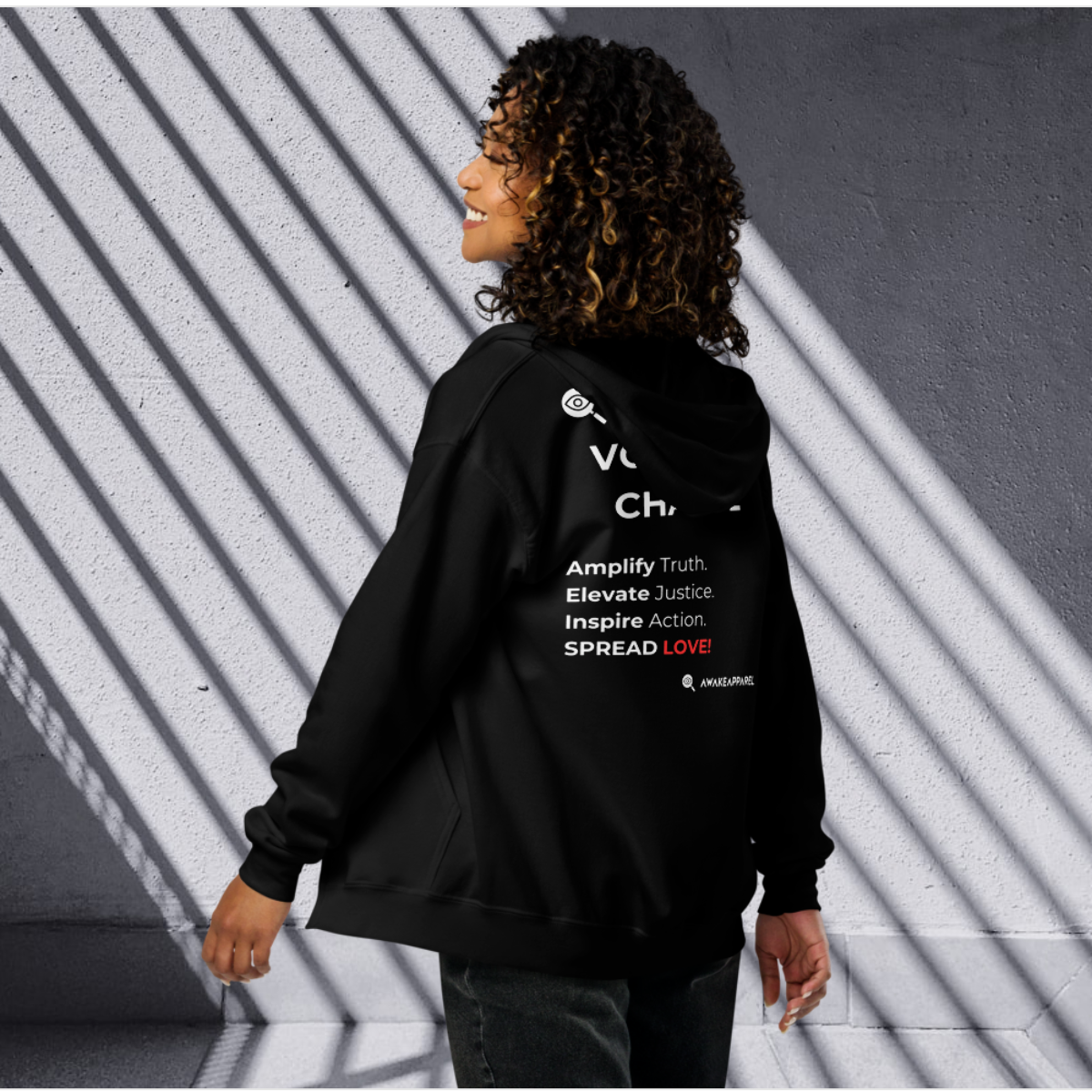 Back of Black Empowered Impact Zip Hoodie - 'Ignite change with our "Voices of Change" t-shirt.' with AwakeApparel Logo